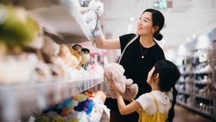 Mother and daughter shopping for jelly cat toys