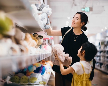 Mother and daughter shopping for jelly cat toys