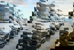 Commercial delivery vans parking in a row, transporting and shipping service company