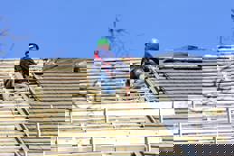 Roofer is working on the roof 