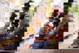 Army father with children tablet at home