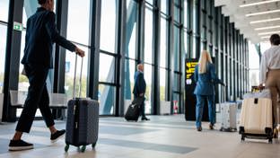Business travelers in airport terminal