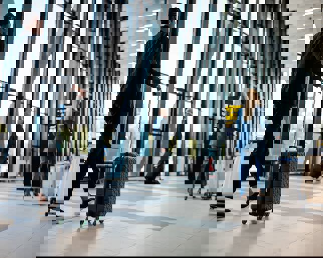 Business travelers in airport terminal