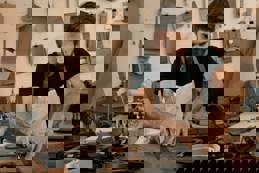 Cropped shot of a young artisan working with leather