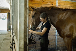 female trainer prepping horse