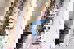 Senior woman using automatic stair lift home