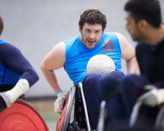 Man in a wheelchair playing a ball sport