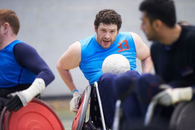 Man in a wheelchair playing a ball sport