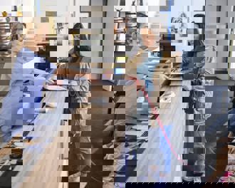 Woman with dog at vet reception