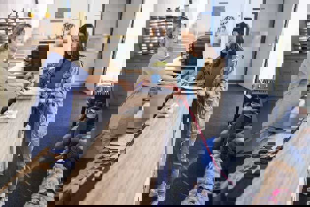 Woman with dog at vet reception