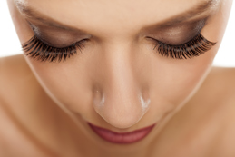 Close up of eyes with long artificial eyelashes