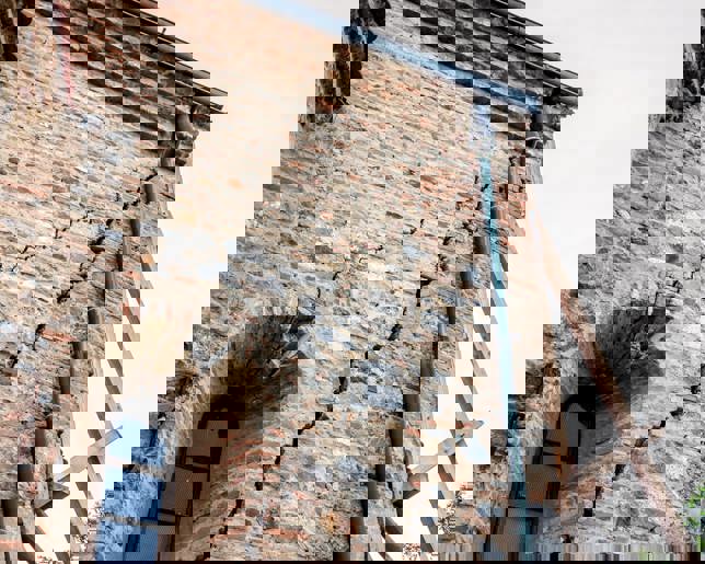 Cracked stone wall renovation needed