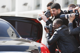 Paparazzi taking pictures of celebrity