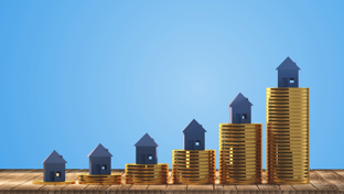 Five miniature house models are placed on stacks of gold coins arranged in increasing height from left to right.