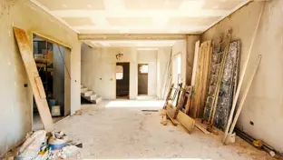 House renovation work in progress with building materials and unfinished interior
