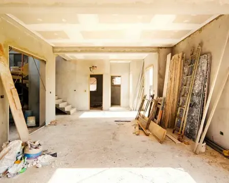 House renovation work in progress with building materials and unfinished interior