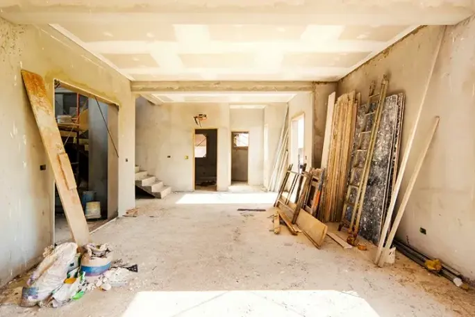 House renovation work in progress with building materials and unfinished interior