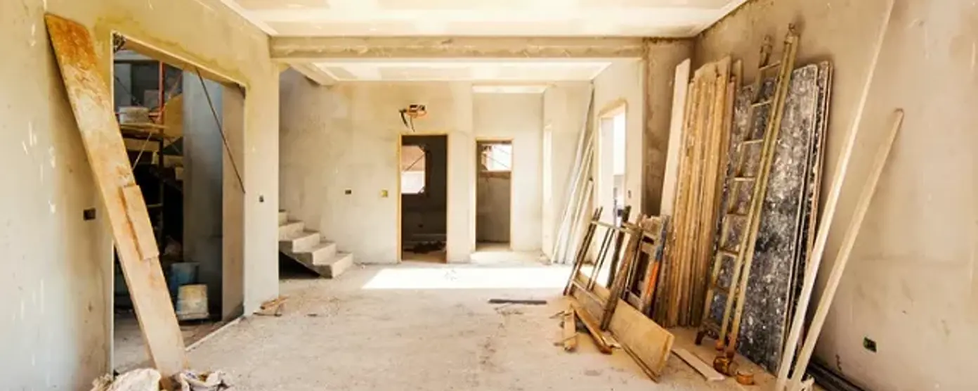 House renovation work in progress with building materials and unfinished interior