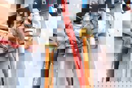 Plumber repairing a gas boiler of a heating home system.