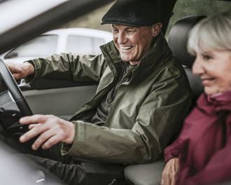 Happy senior couple on road trip