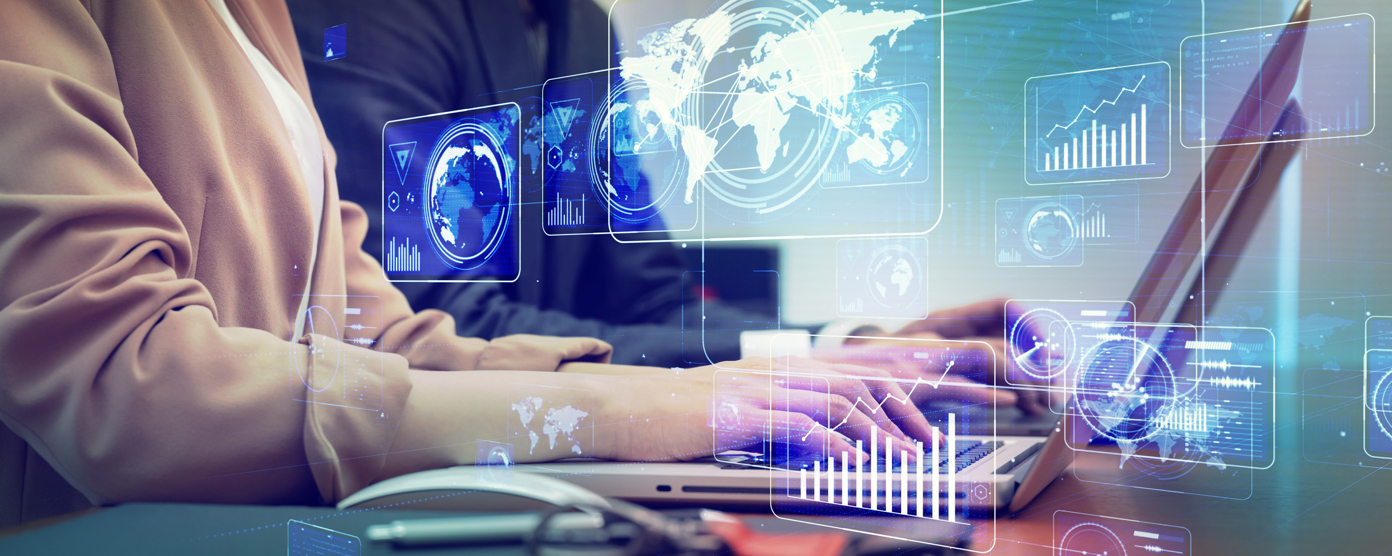  Business professionals working on laptops with futuristic holographic analytics, world map, and data charts overlaying a modern office scene
