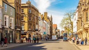 A busy high street with shoppers 