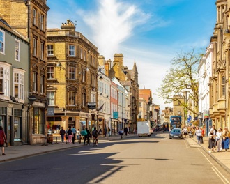 A busy high street with shoppers 