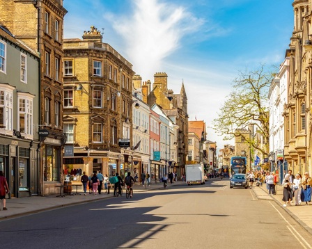 A busy high street with shoppers 