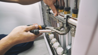 Plumber fixing by professional tool