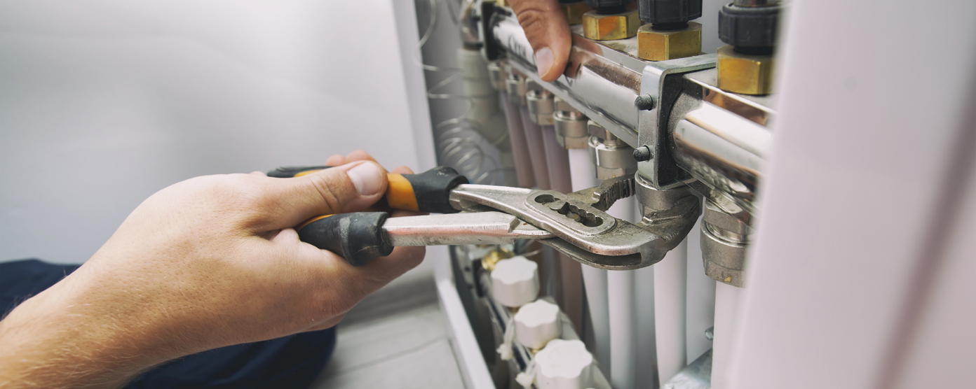 Plumber fixing by professional tool