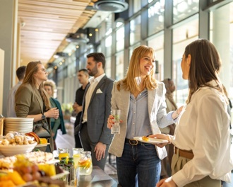 colleagues smiling at an office buffet