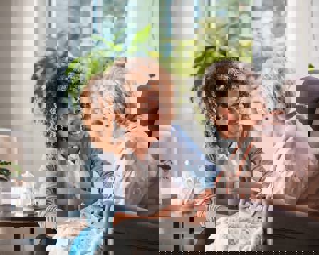 Nurse supporting eldery lady