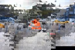 Recycling factory worker checking plastic resins