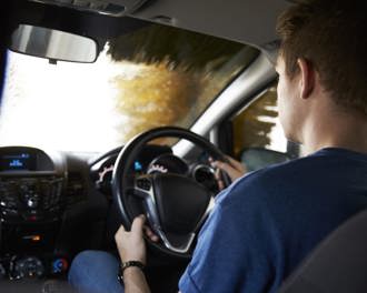 Motorist Driving Through Automated Car Wash