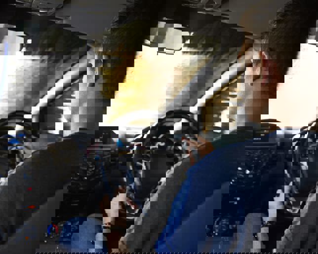 Motorist Driving Through Automated Car Wash