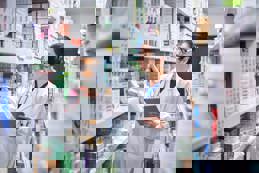 Pharmacist managing inventory with tablet