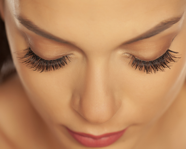 Closeup of beautiful closed eyes and eyelash extension