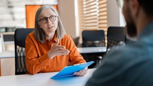 Mature lady in a business meeting