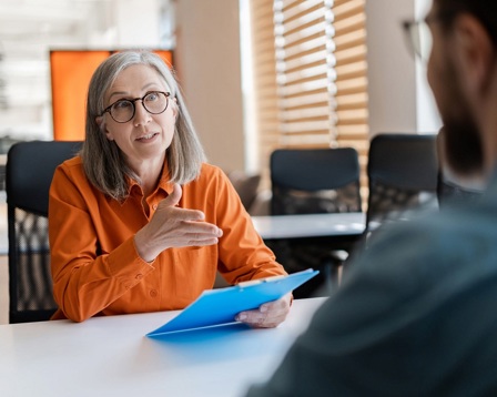 Mature lady in a business meeting