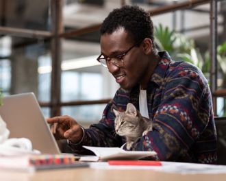 man-working-on-his-laptop-pointing-at-the-screen