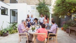 friends enjoying a meal in garden