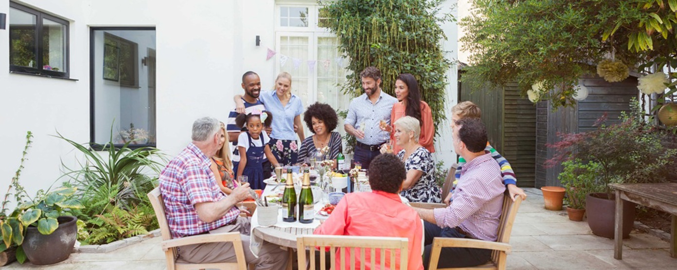 friends enjoying a meal in garden