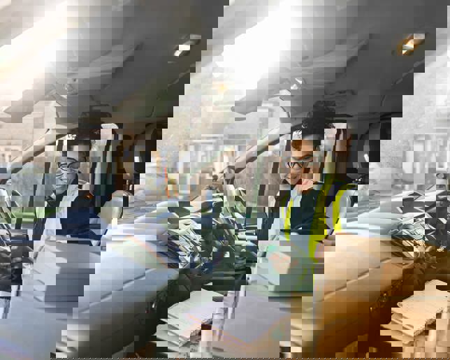 Delivery driver preparing parcels