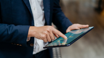 Man checking progress chart on tablet