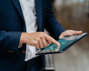 Man checking progress chart on tablet