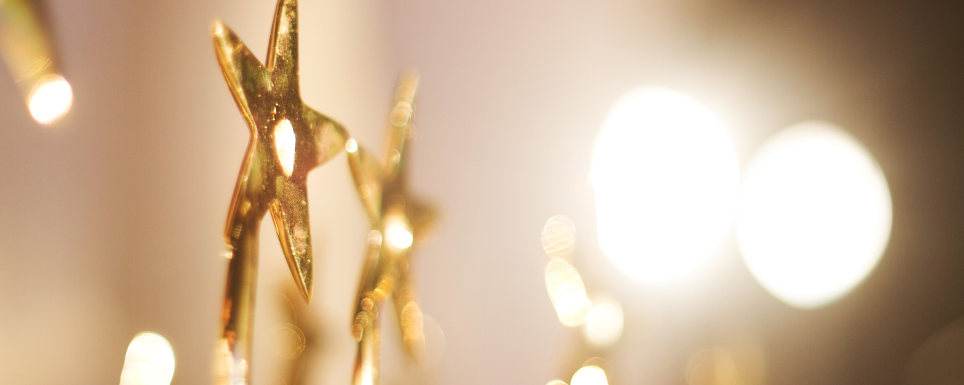 Gold stars with lights aournd them