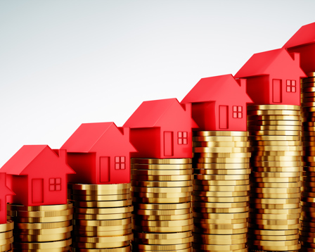 Red miniature houses sit on progressively taller stacks of gold coins, representing rising house prices and increasing wealth in the real estate market.