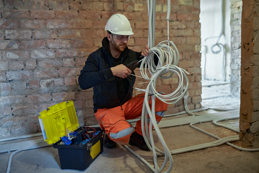 Electrical contractor working with cables