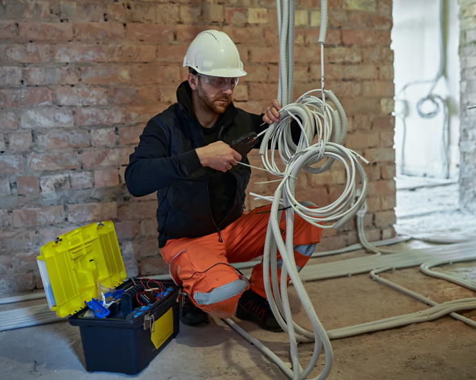 Electrical contractor working with cables