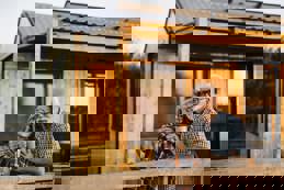 Senior couple cabin patio evening